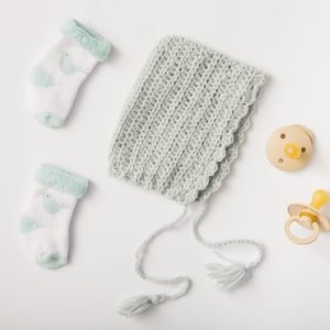 woolen-headwear-socks-pacifiers-white-backdrop